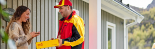 Courier person deliver a parcel to customer